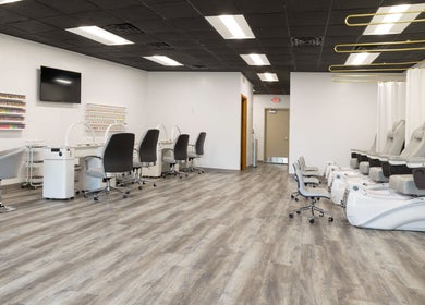 Modern interior of Mai Nail Salon & Spa in Appleton, Wisconsin, US featuring elegant nail and pedicure stations.