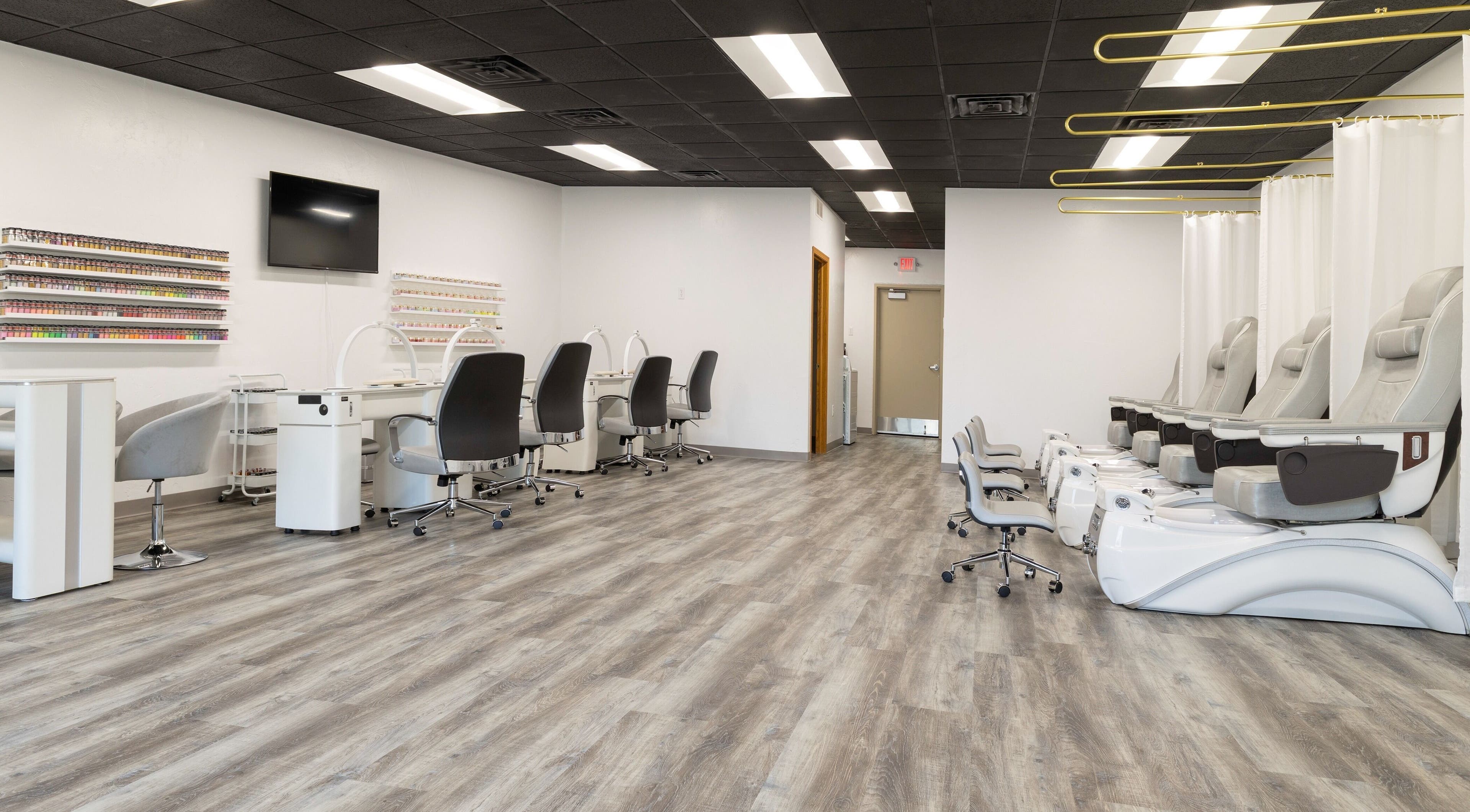 Modern interior of Mai Nail Salon & Spa in Appleton, Wisconsin, US featuring elegant nail and pedicure stations.