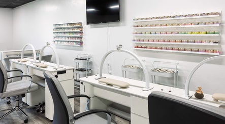 Mai Nail Salon & Spa in Appleton, Wisconsin, features sleek manicure stations and vibrant nail polish displays.