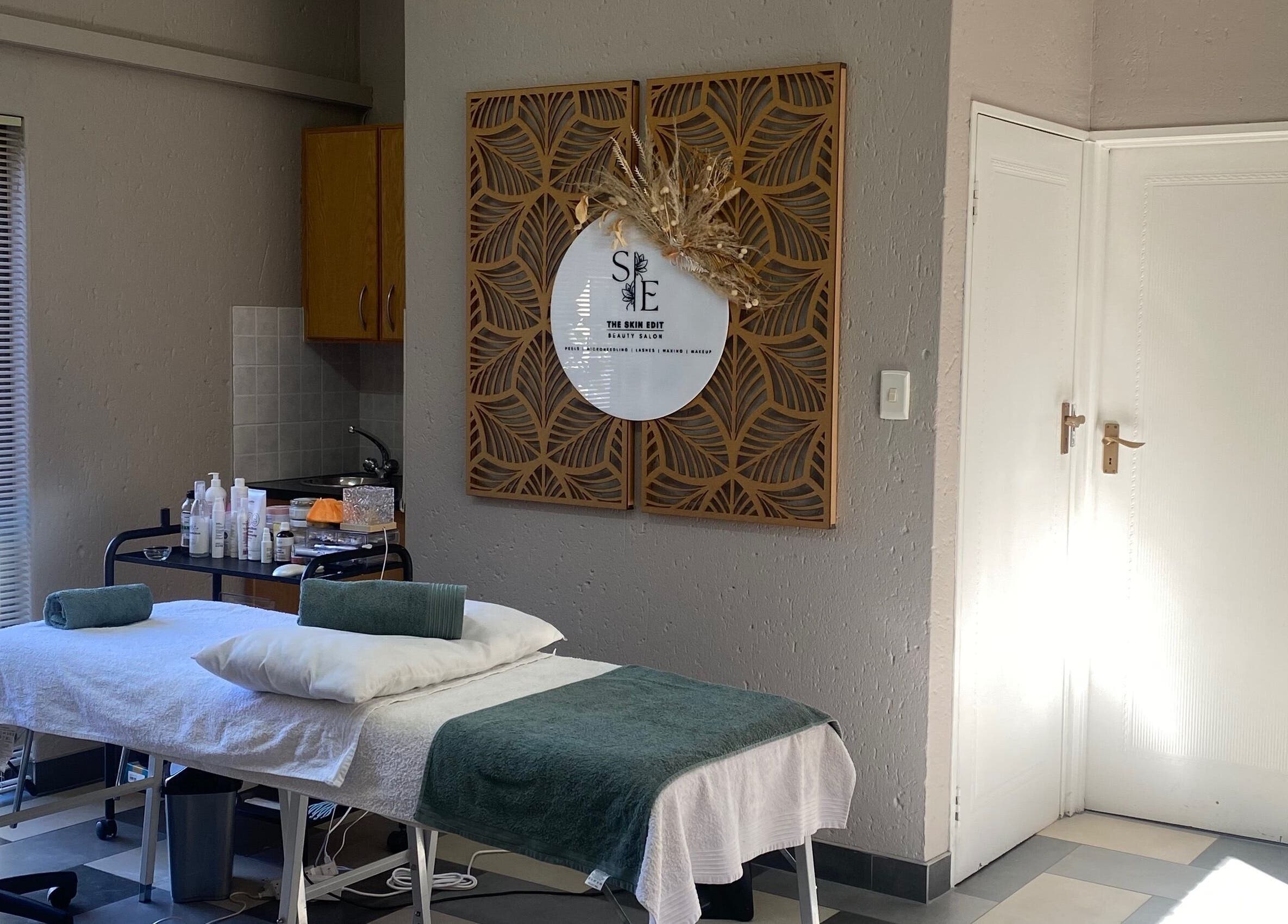 The Skin Edit therapy room in Roodepoort, Gauteng, ZA with a comfortable treatment bed and serene decor.