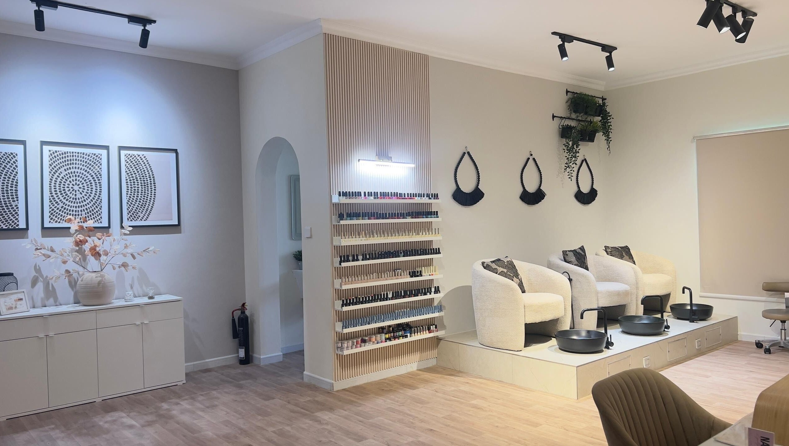 Modern, tranquil nail area at RAZ Salon, Muscat, Muscat Governorate, OM showcases chic decor.
