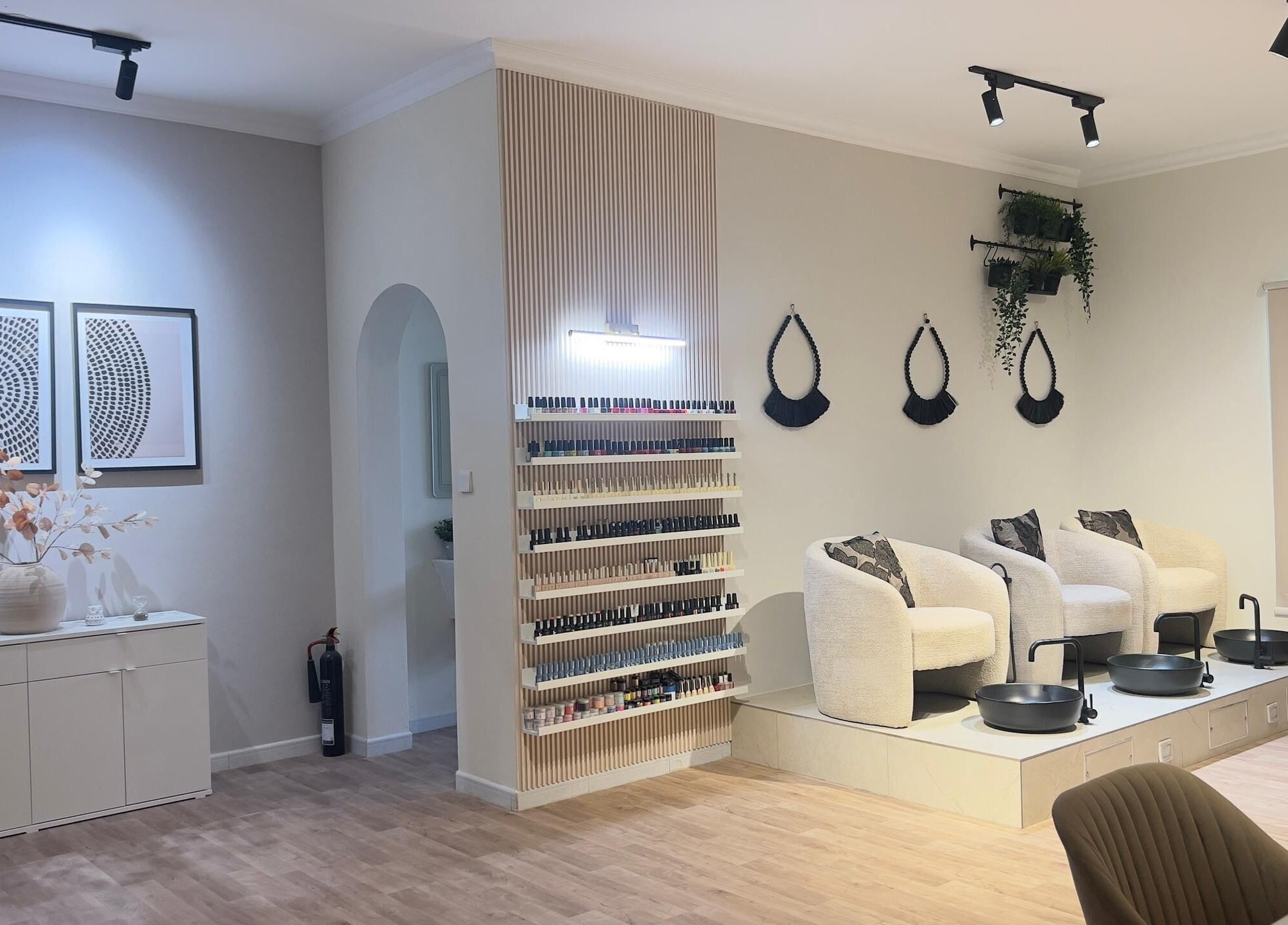 Modern, tranquil nail area at RAZ Salon, Muscat, Muscat Governorate, OM showcases chic decor.
