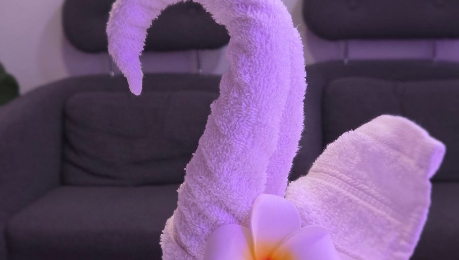 Artfully folded towel resembling a swan at KHUN MAI THAI MASSAGE in London, England, GB.