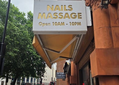 Exterior sign of KHUN MAI THAI MASSAGE, showcasing nail and massage services in London, England, GB.