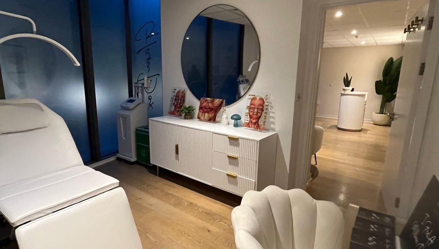 Modern treatment room at Candie Kings Aesthetics, London, England, GB with sleek decor and treatment chair.