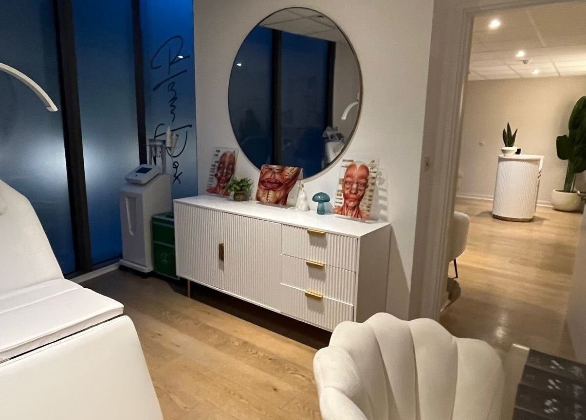 Modern treatment room at Candie Kings Aesthetics, London, England, GB with sleek decor and treatment chair.