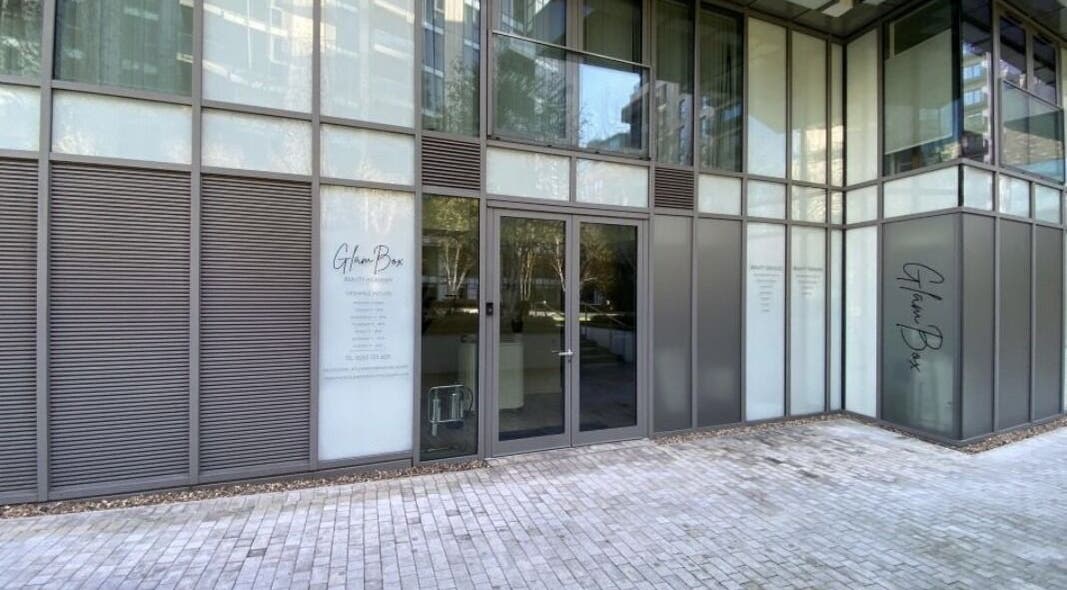 Front entrance of Candie Kings Aesthetics in London, England, GB, highlighting sleek glass design.