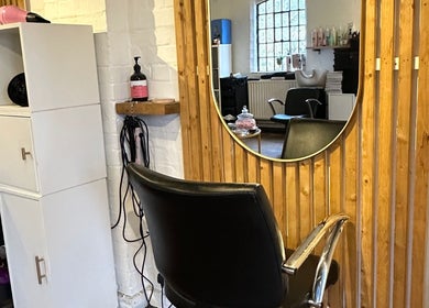 Modern salon chair and chic mirror at Beauty, Hair & Beyond, Stevenage, England, GB.