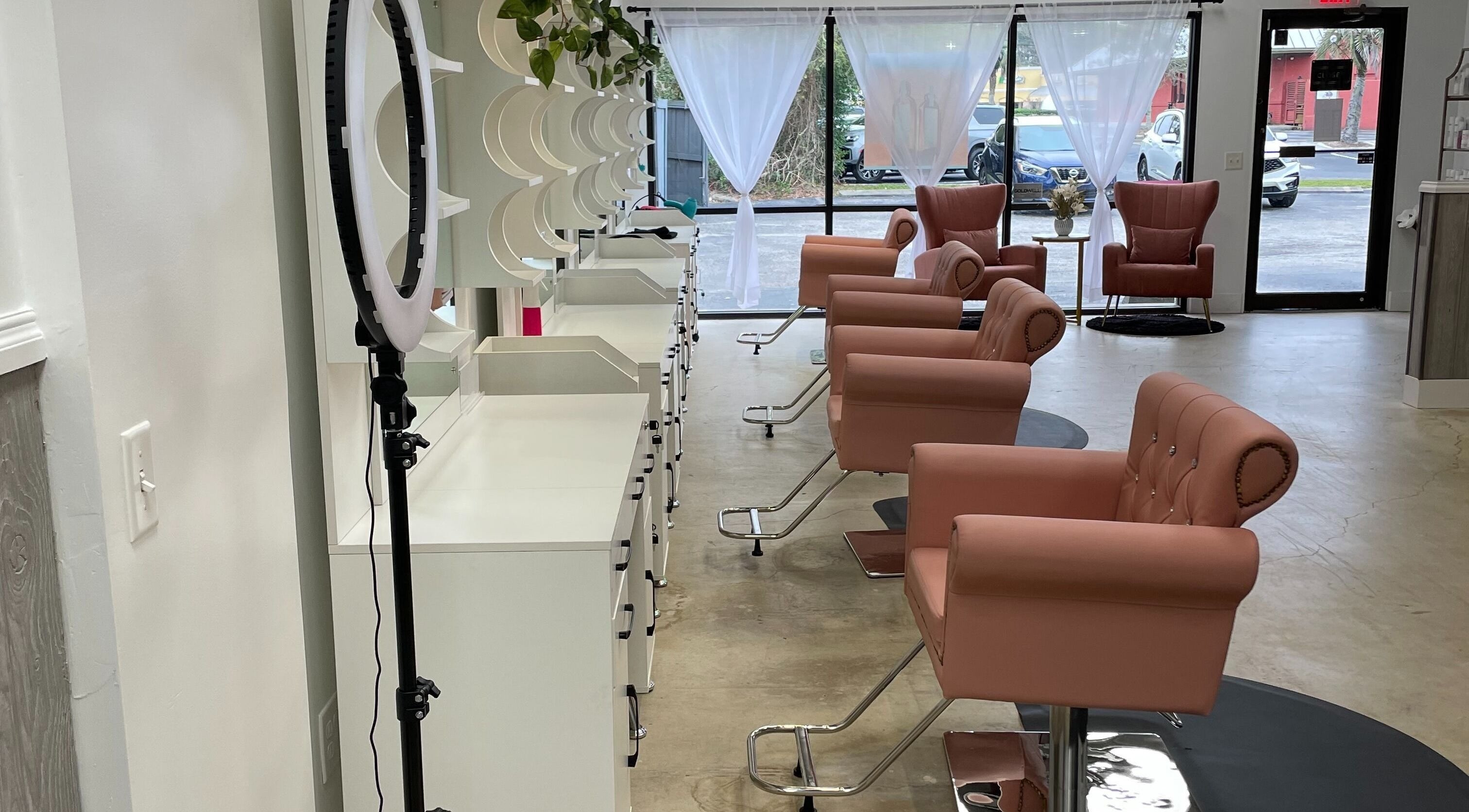 Chic interior of Magnolias Hair Studio, Jacksonville, Florida, US, featuring stylish salon chairs and modern decor.