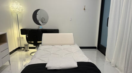 Serene treatment room at KaHBee by Lee in Torrance, California, US featuring a cozy bed and ambient lighting.