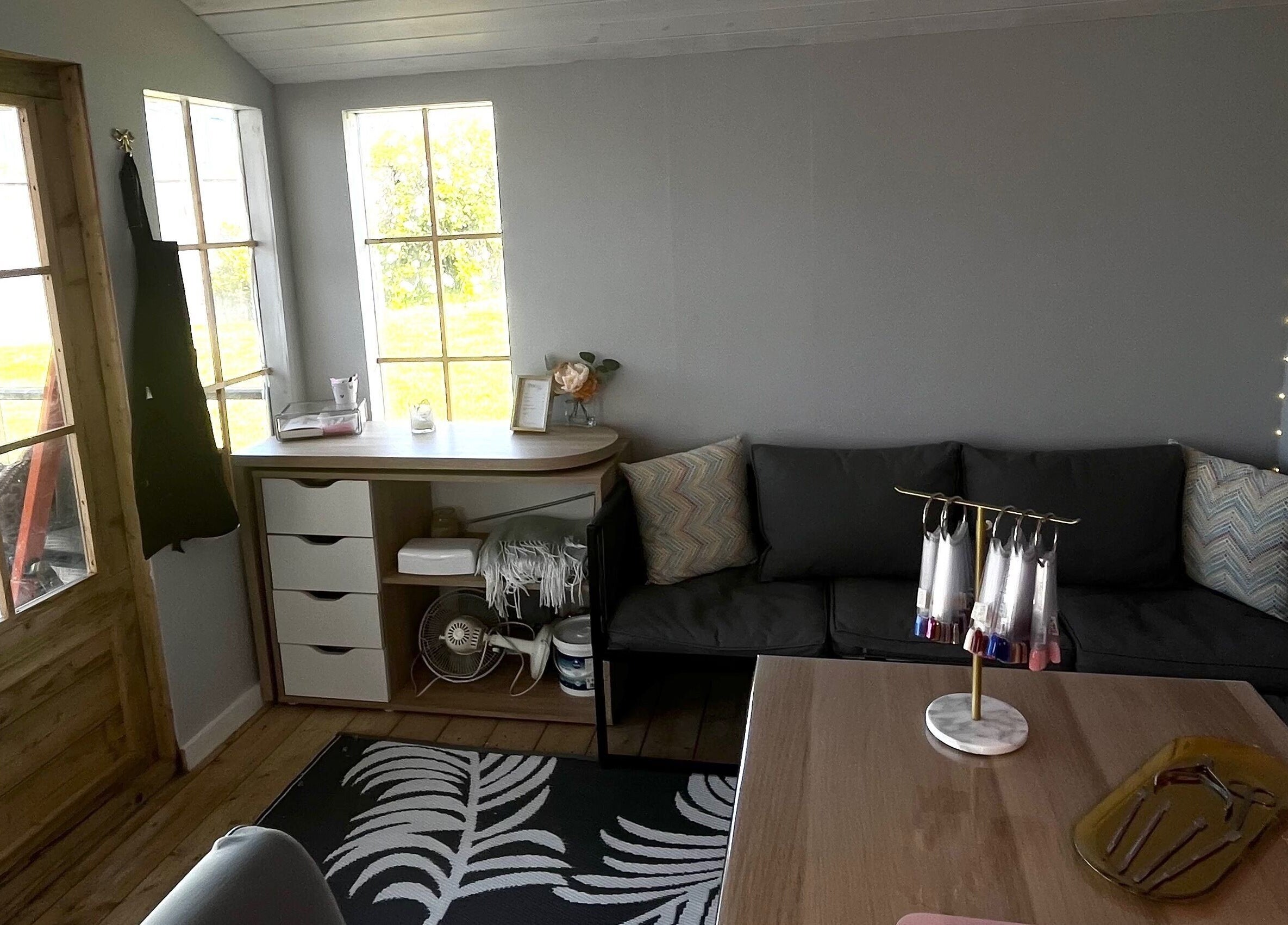 Cozy interior of Nails By Caoimhe in Castlebar, County Mayo, IE, featuring a seating area and nail art display.