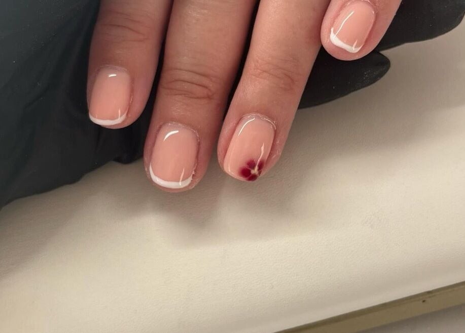 Elegant French manicure with floral design at Nails By Caoimhe, Castlebar, County Mayo, IE.