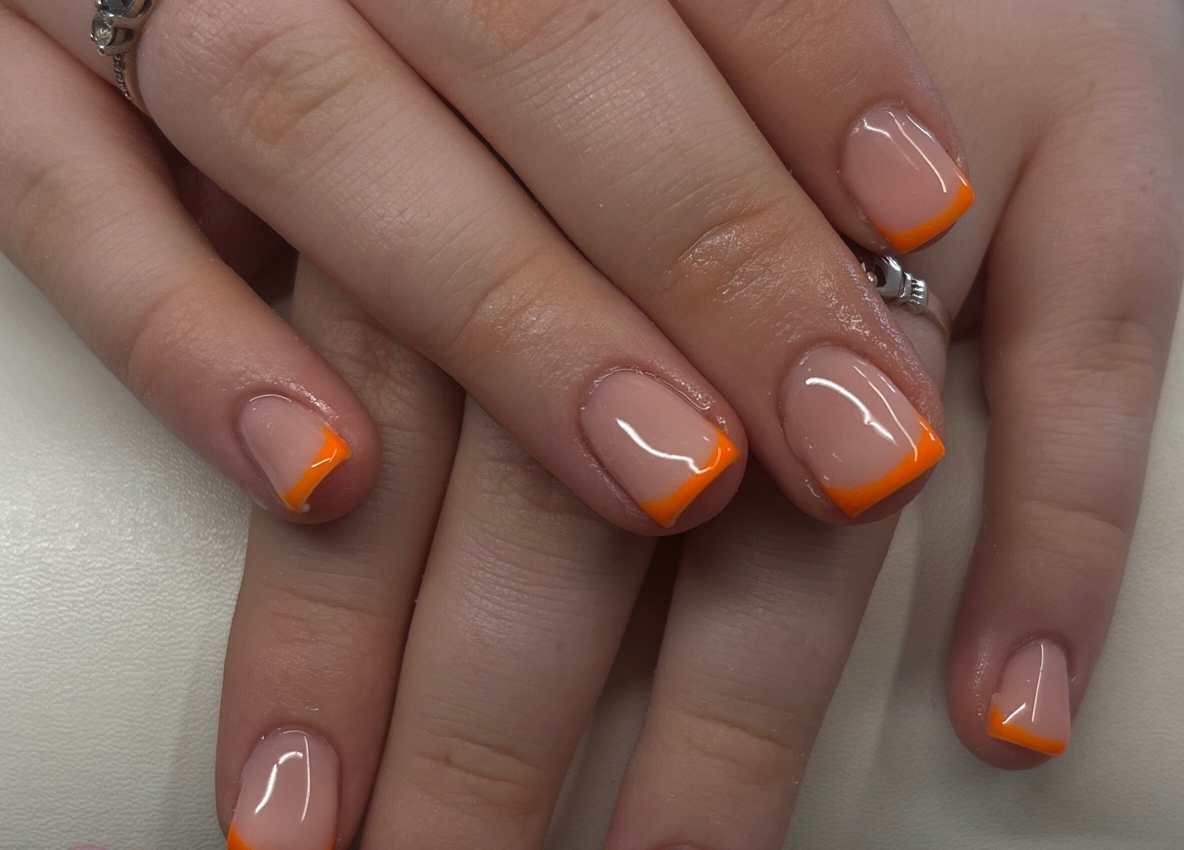 Vibrant orange French manicure at Nails By Caoimhe, Castlebar, County Mayo, IE.