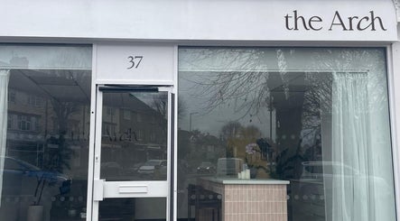 Entrance of Medermica in Bristol, England, GB showcasing modern facade with large glass windows.