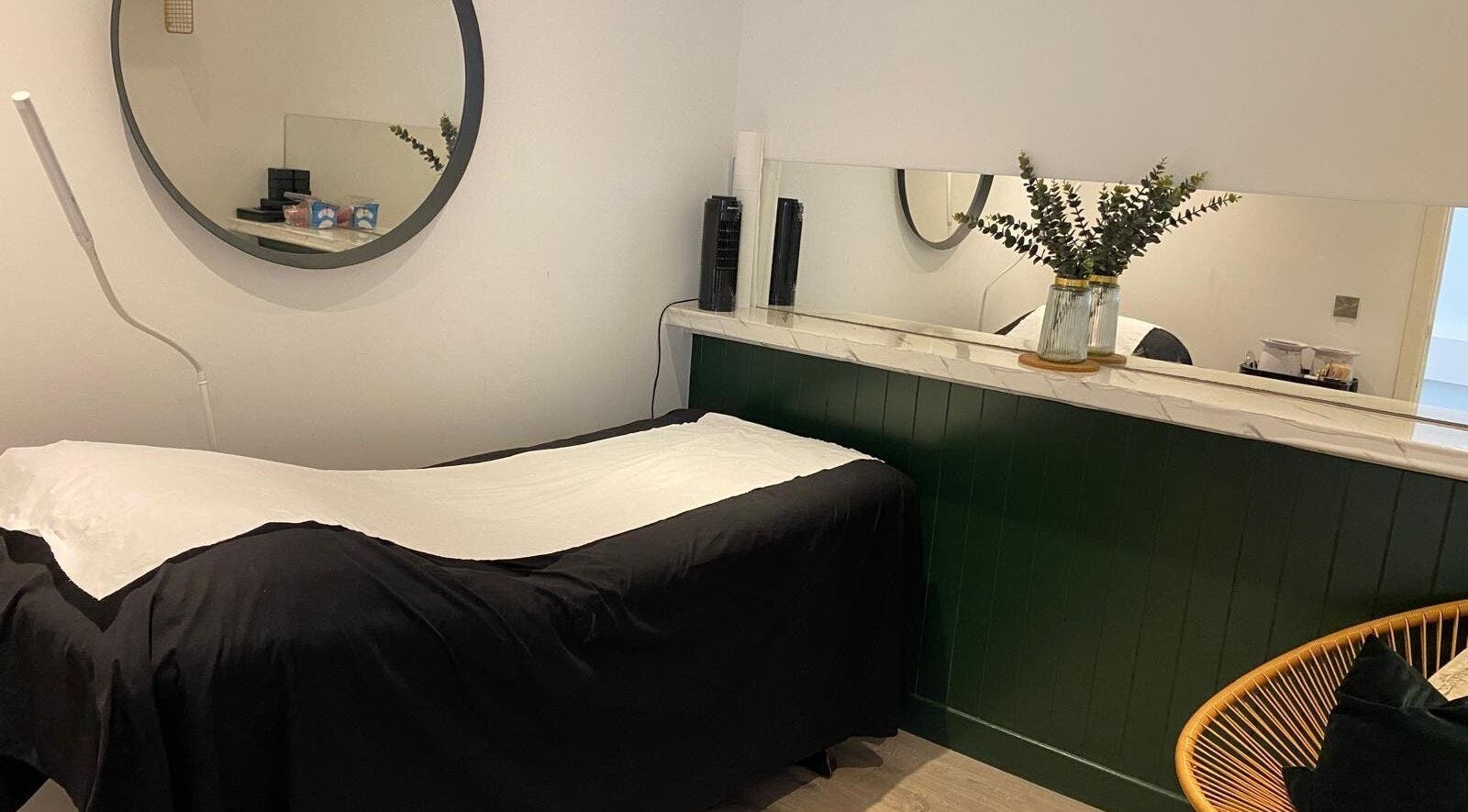 Relaxing treatment room at A2aesthetics, Dublin, County Dublin, IE, featuring a massage table and modern decor.