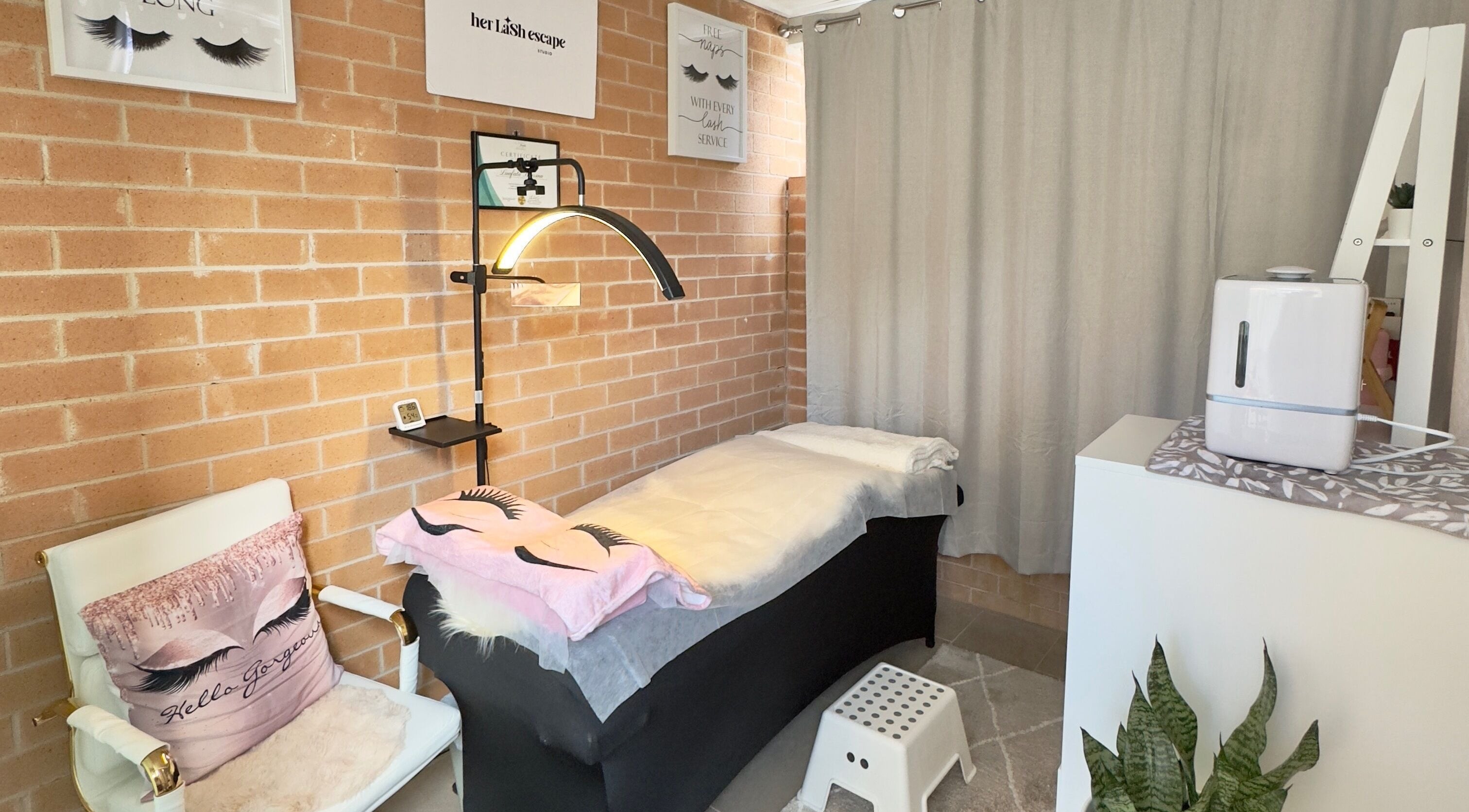 Relaxing interior of Her Lash Escape, Minto, New South Wales, AU, showcasing a comfortable lash treatment space.
