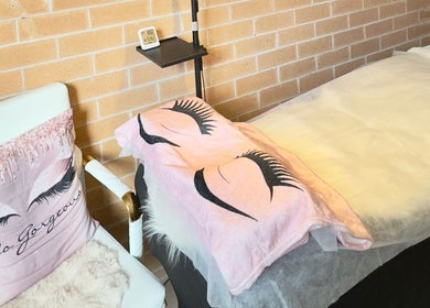 Cozy treatment area at Her Lash Escape, Minto, New South Wales, AU, with plush eyelash-themed decor.