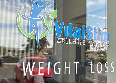 VitalSlim Wellness Services entrance sign in Chandler, Arizona, US, showcasing weight loss services.
