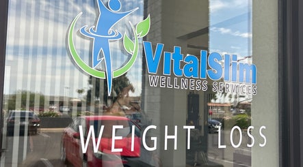 VitalSlim Wellness Services entrance sign in Chandler, Arizona, US, showcasing weight loss services.