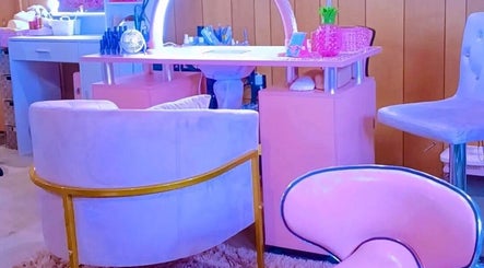 Stylish pink and blue decor at AWrelax Spa, Davenport, Iowa, US. Inviting space for relaxation and beauty services.
