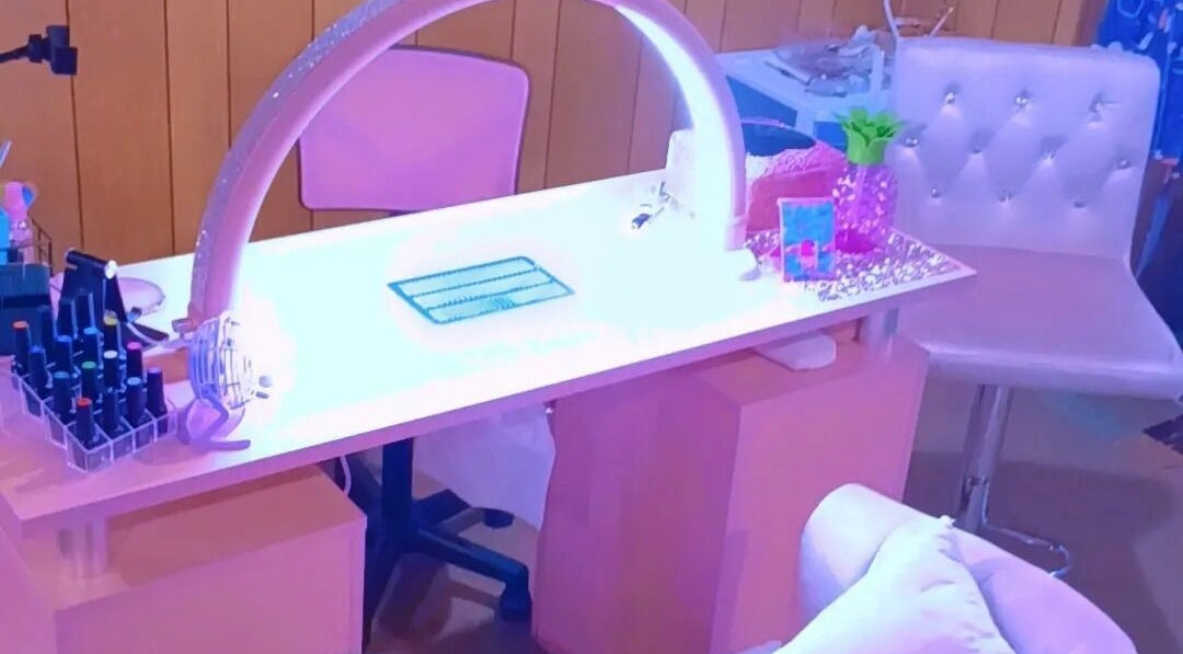 Chic nail station at AW Relax Spa in Davenport, Iowa, US featuring a modern setup with vibrant lighting.