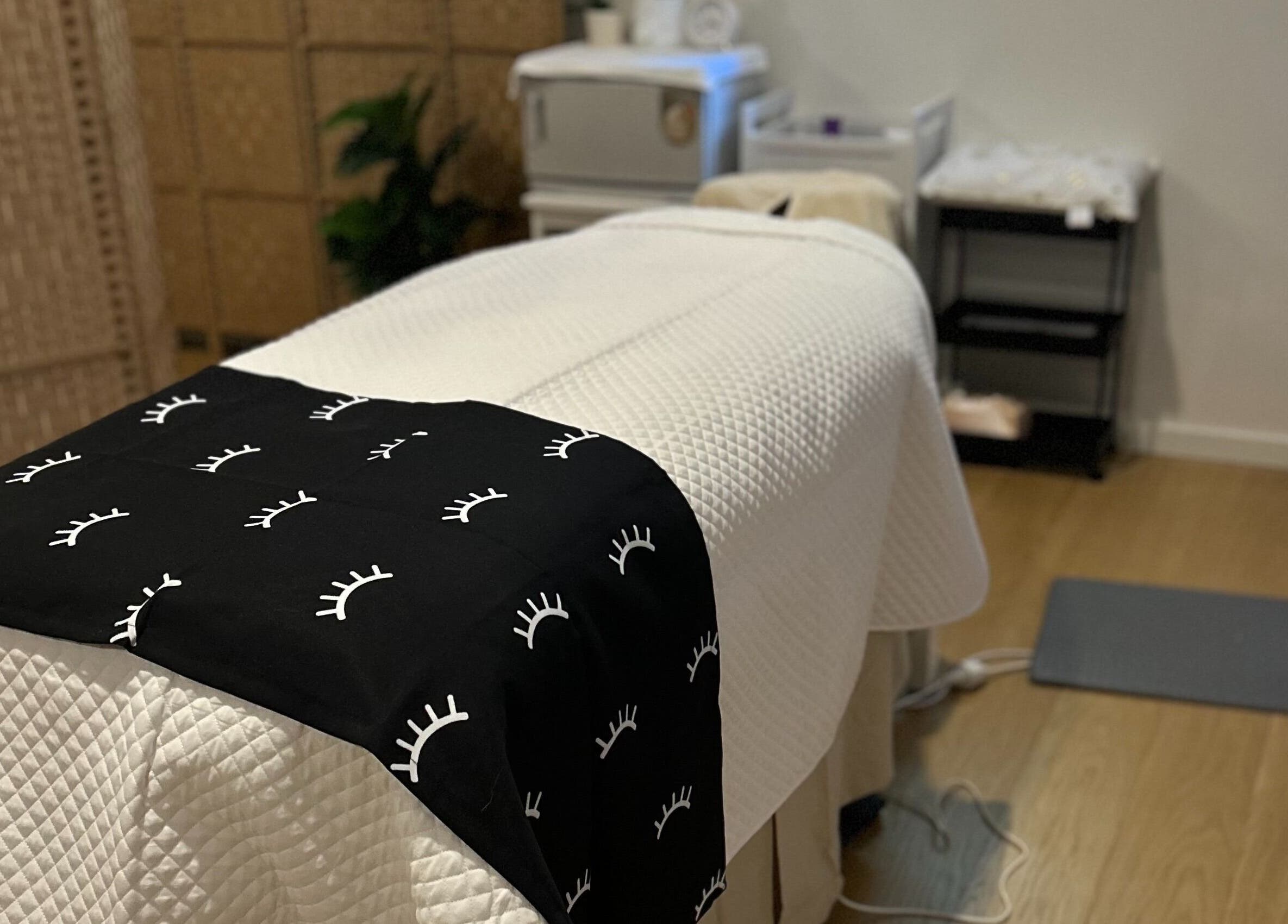 Cozy massage bed at Skin Deep Massage Therapy, Crib Point, Victoria, AU, showcasing serene atmosphere.