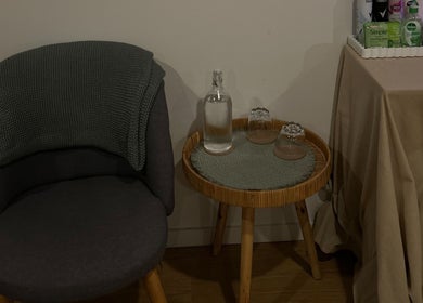 Cozy seating area at Skin Deep Massage Therapy, Crib Point, Victoria, AU with a chair, table, and essentials.