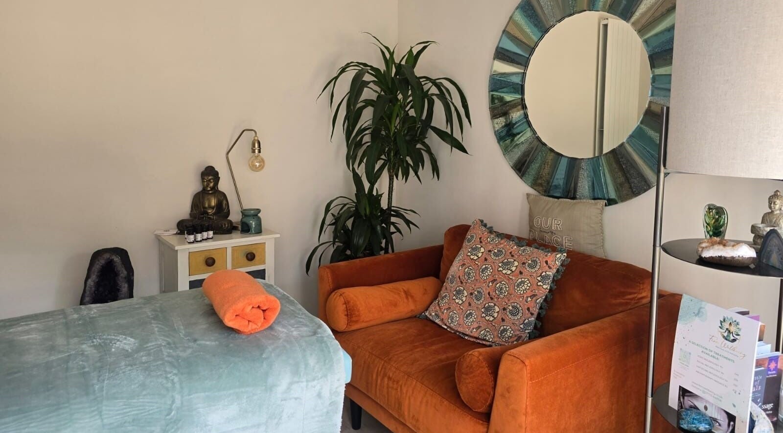 A tranquil space at Fern Wellbeing, Paignton, England, GB featuring a massage bed and cozy decor.