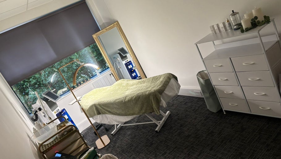 Tranquil spa room at Shades of Beauty in Aylesbury, England, GB. Features a massage table and elegant decor.
