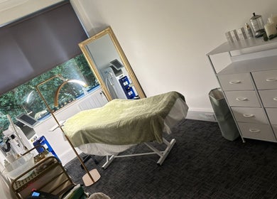 Tranquil spa room at Shades of Beauty in Aylesbury, England, GB. Features a massage table and elegant decor.