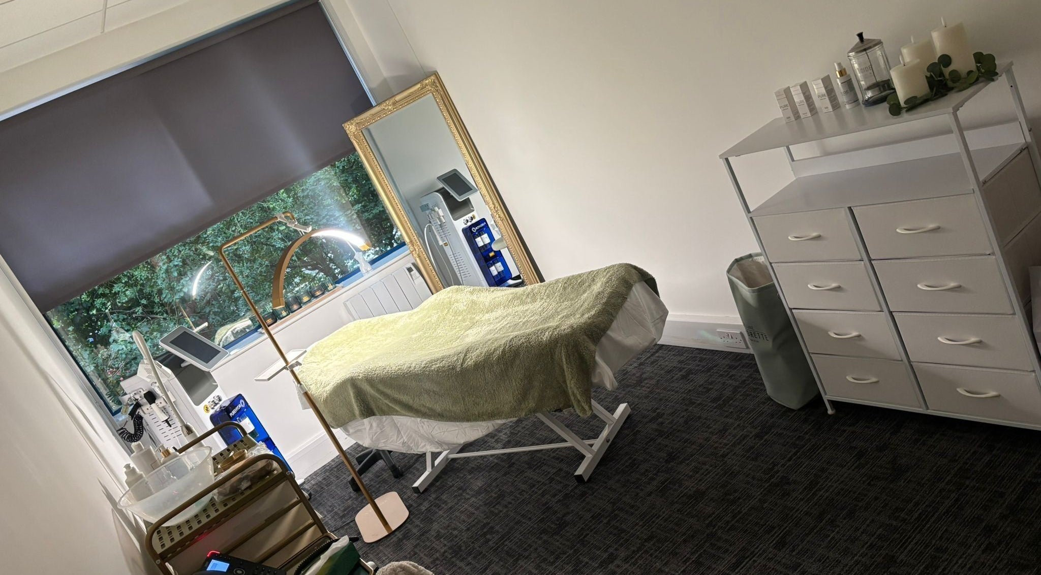 Tranquil spa room at Shades of Beauty in Aylesbury, England, GB. Features a massage table and elegant decor.