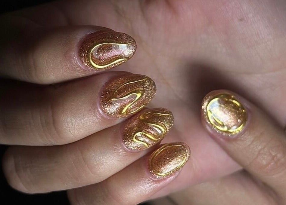 Golden nails with artistic design at Stay Classy Clayfield, Clayfield, Queensland, AU.