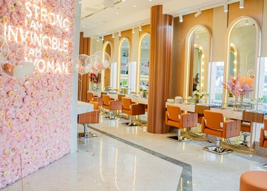 Luxurious interior of Charcole Lovers salon in Colombo, Western Province, LK, featuring pink floral wall.