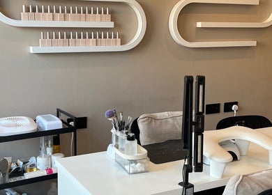 Modern nail station at At Your Finger Tips, Blantyre, Scotland, GB, showcasing stylish decor.