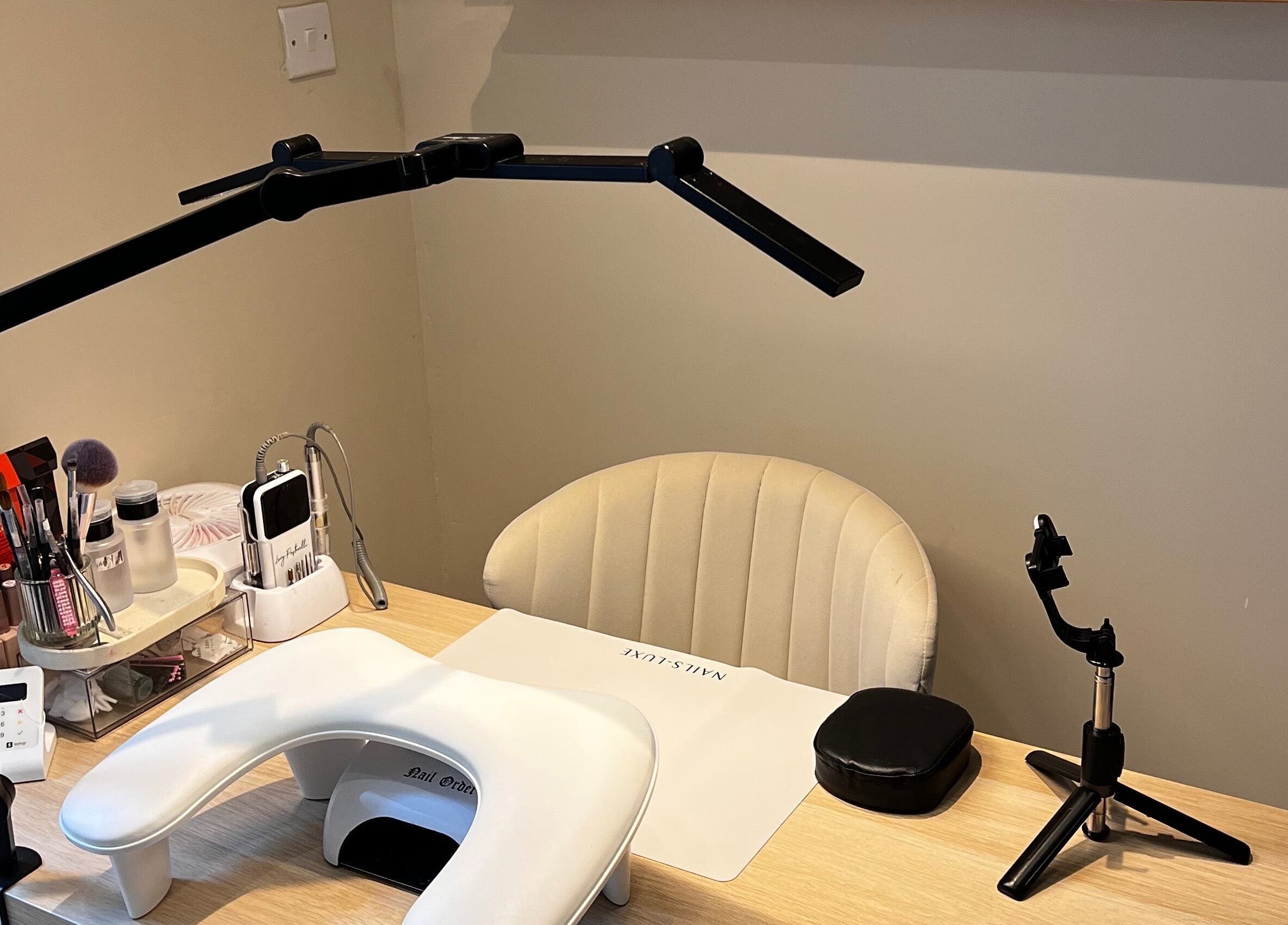 Inviting nail care station at At Your Finger Tips, Cambuslang, Scotland, GB, featuring modern tools and seating.