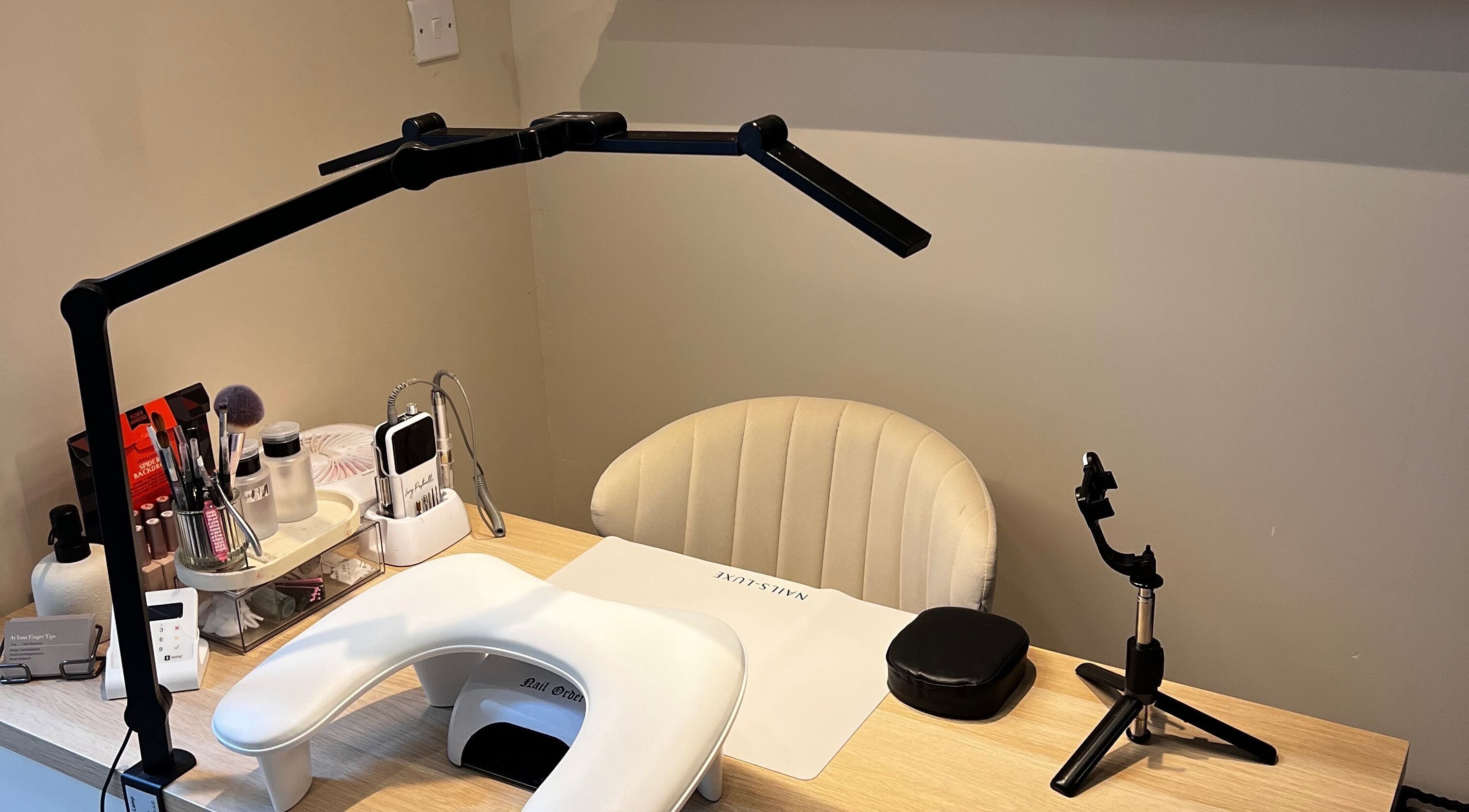 Inviting nail care station at At Your Finger Tips, Cambuslang, Scotland, GB, featuring modern tools and seating.