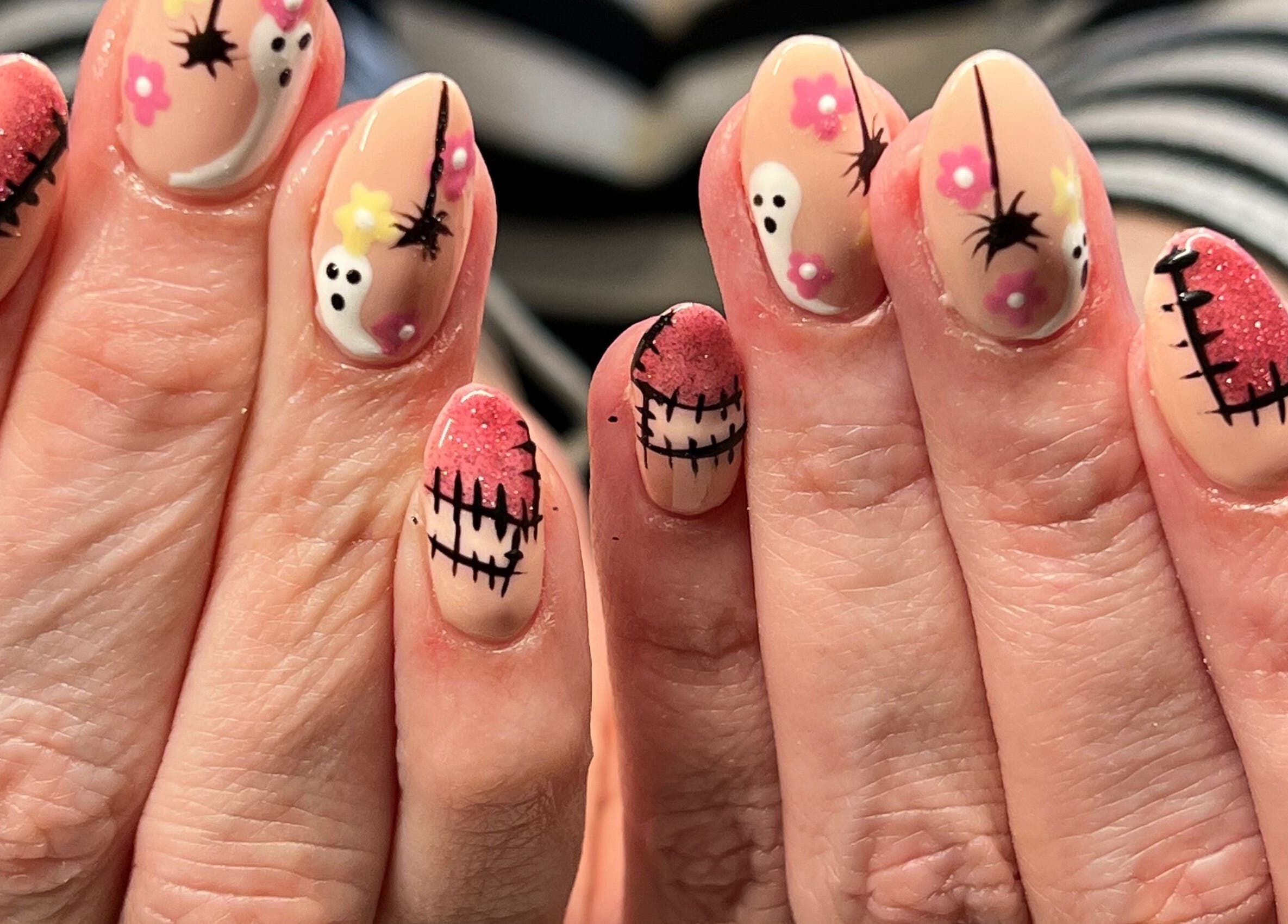Vibrant Halloween nail designs at At Your Finger Tips, Cambuslang, Scotland, GB. Intricate and colorful art.