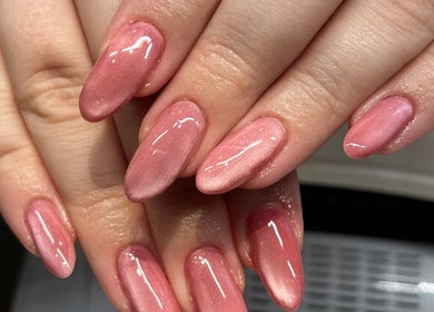 Glossy rose-colored nails manicure at At Your Finger Tips, Cambuslang, Scotland, GB.
