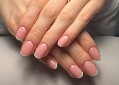 Elegant French manicure at Nails by Natalie Anne, Canterbury, New South Wales, AU; smooth pink finish.