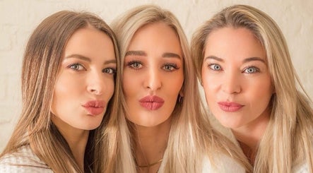 Three smiling women at Bohemian Wellness & Spa in Pretoria, Gauteng, ZA, showcasing a happy and relaxed atmosphere.