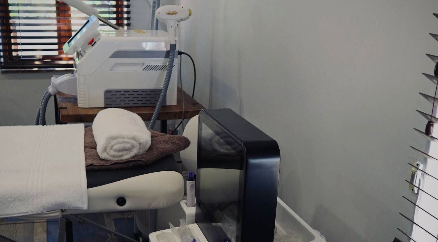 Relaxing treatment area at Bohemian Wellness & Spa, Pretoria, Gauteng, ZA with modern equipment and cozy towels.