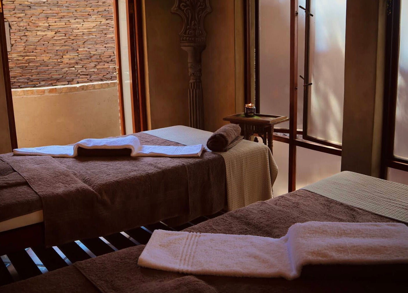 Cozy spa treatment room at Bohemian Wellness & Spa, Pretoria, Gauteng, ZA with elegant decor and soft lighting.