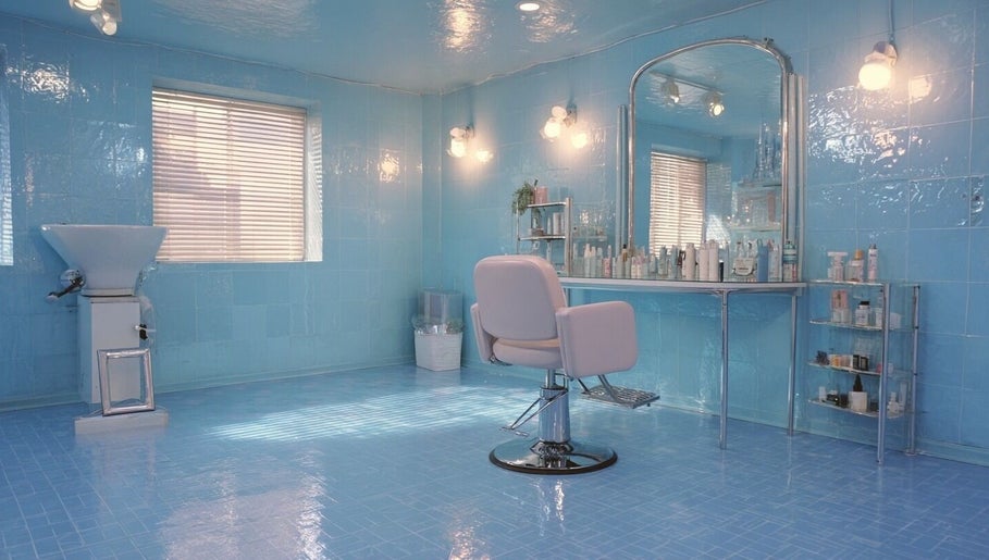 Modern blue salon interior at Heaven Luxe Aesthetics, London, England, GB for premium beauty services.