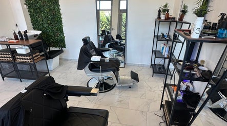 Stylish interior of Újlipót Barber Shop in Budapest, Magyar, HU with chairs and grooming stations.
