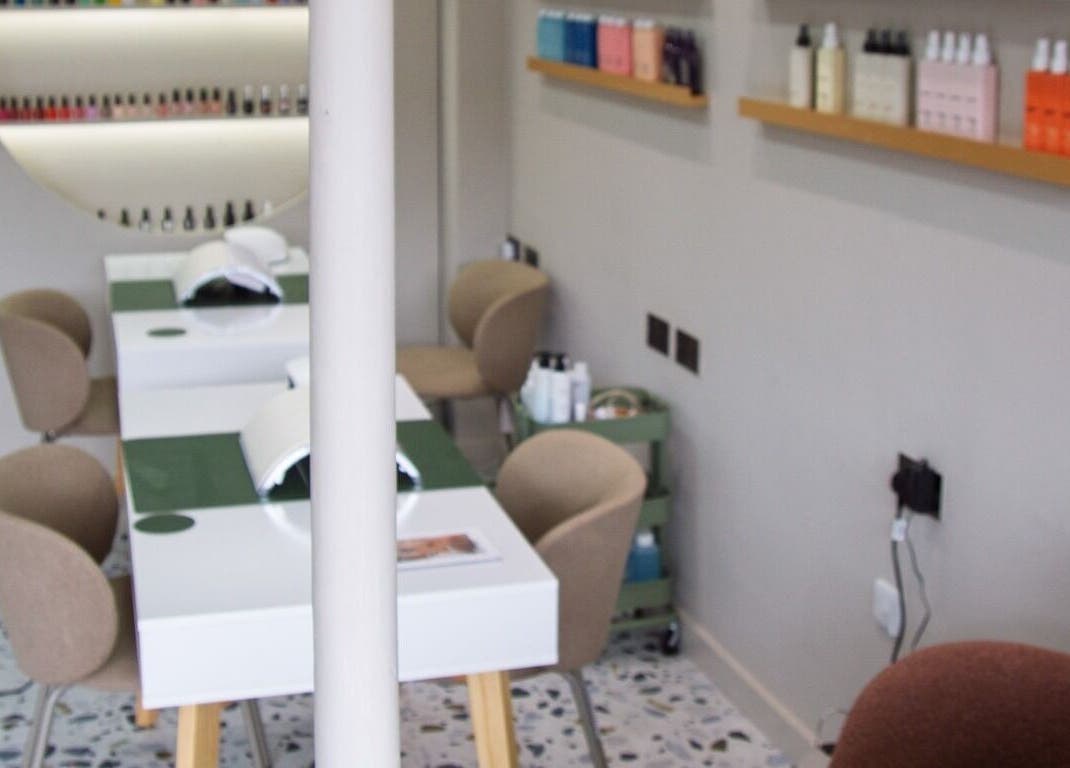 Cozy nail station at Flow in London, England, GB with modern design and nail care products on display.