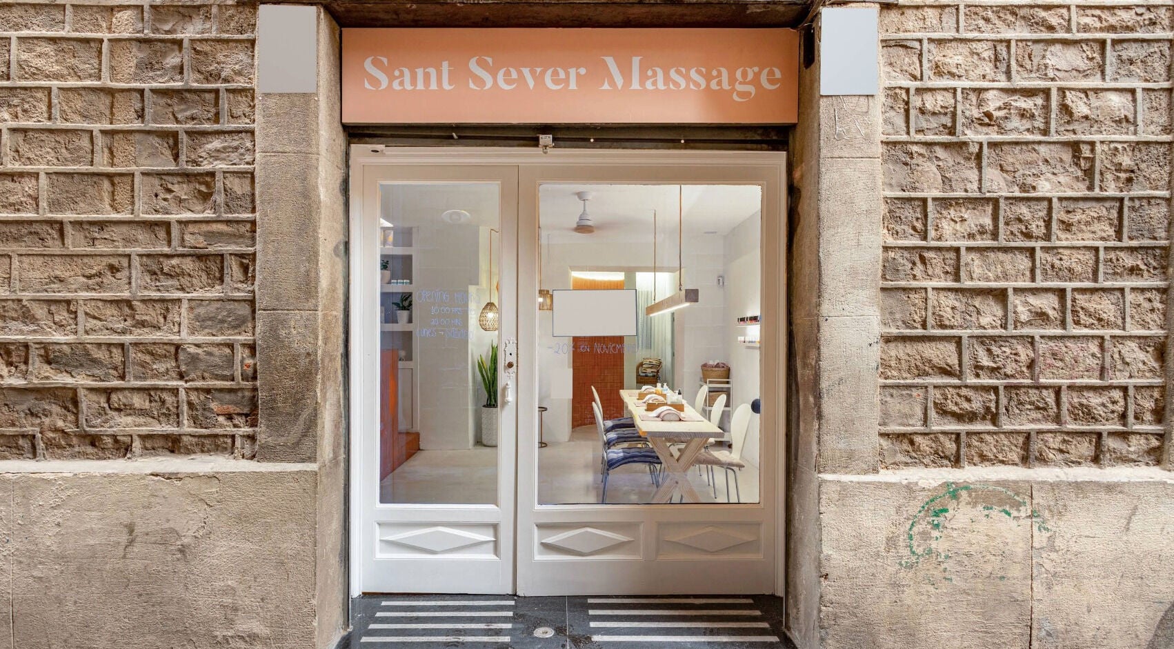 Entrance of Sant Sever Massage, a serene venue in Barcelona, Catalunya, ES, showcasing its welcoming facade.