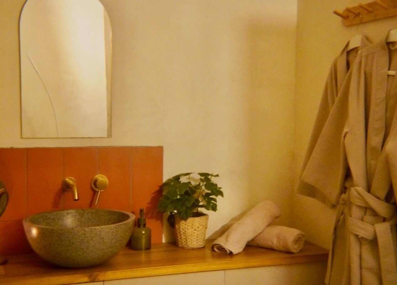 Relaxing spa nook at Sant Sever Massage, Barcelona, Catalunya, ES with robes and decor.