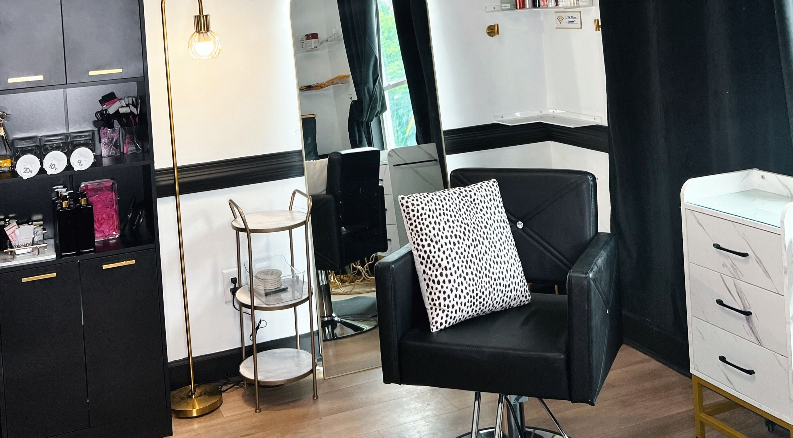 Stylish interior of Eleventh Hour Hair in Gainesville, Georgia, US, showcasing a modern salon chair and decor.