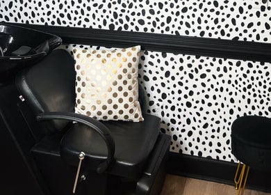 Elegant salon chair and polka dot decor at Eleventh Hour Hair in Gainesville, Georgia, US.