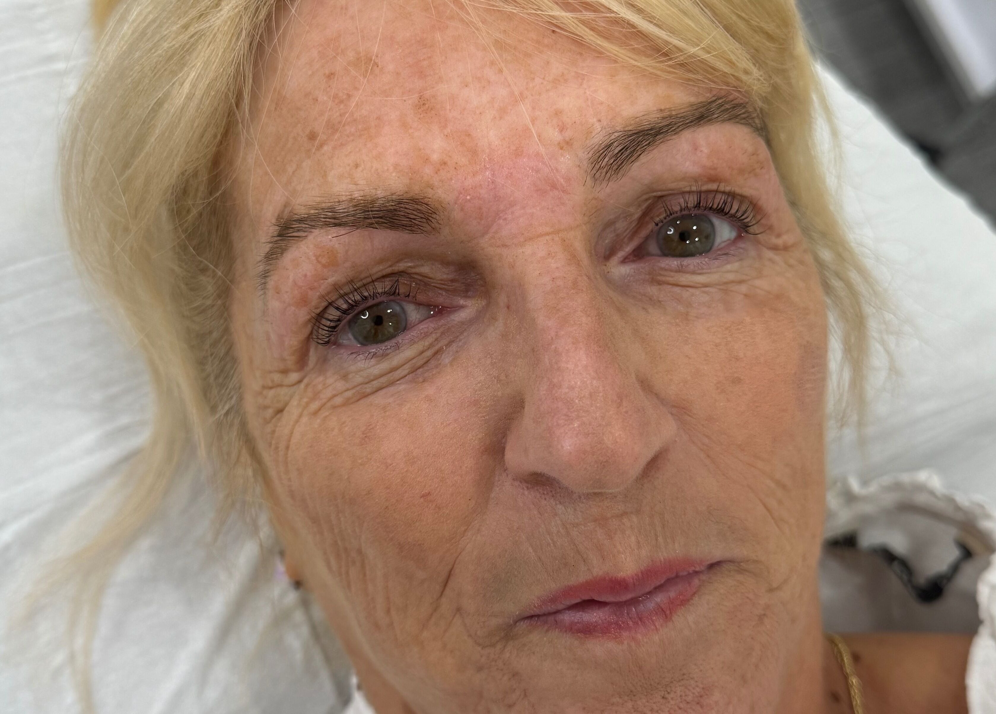 A refreshed client after beauty treatment at Studio by MH, Liverpool, England, GB.